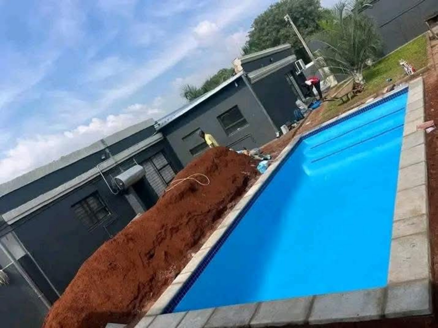 Finished swimming pool by The Pool Guys Co.